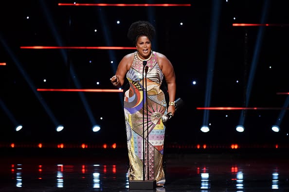 Lizzo accepts the Entertainer of the Year award onstage during the 51st NAACP Image Awards