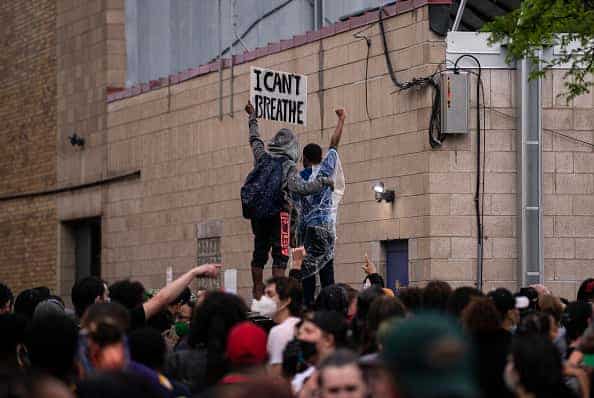 Protesters demonstrate against the death of George Floyd outside the 3rd Precinct Police Precinct on May 26