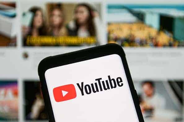 In this photo illustration a YouTube logo seen displayed on a smartphone.