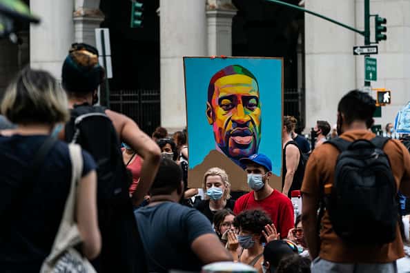 A portrait of George Floyd is seen during a protest encampment on June 28