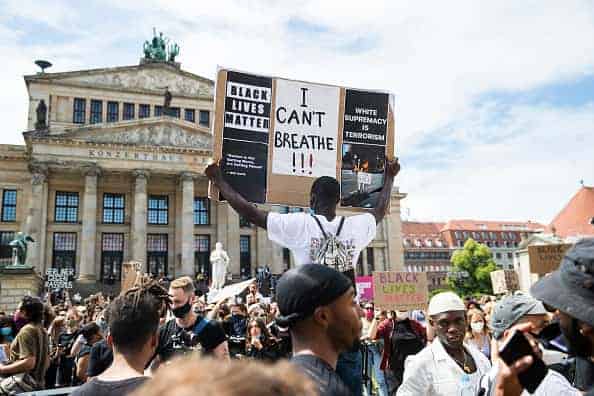 People protest against racism and police brutality and pay tribute to George Floyd at Gendarmenmarkt in Berlin