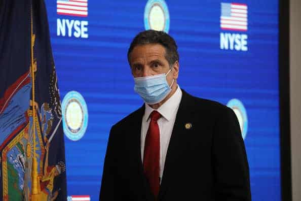 New York Governor Andrew Cuomo holds his daily press briefing at the New York Stock Exchange (NYSE) on the first day that traders are allowed back onto the historic floor of the exchange on on May 26
