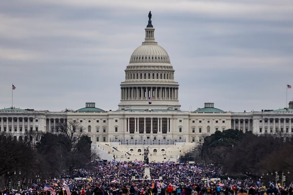 Supporters of President Donald Trump surround the U.S. Capitol following a rally on January 6
