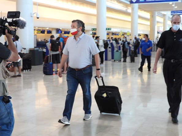 Sen. Ted Cruz (R-TX) checks in for a flight at Cancun International Airport after a backlash over his Mexican family vacation as his home state of Texas endured a Winter storm on February 18
