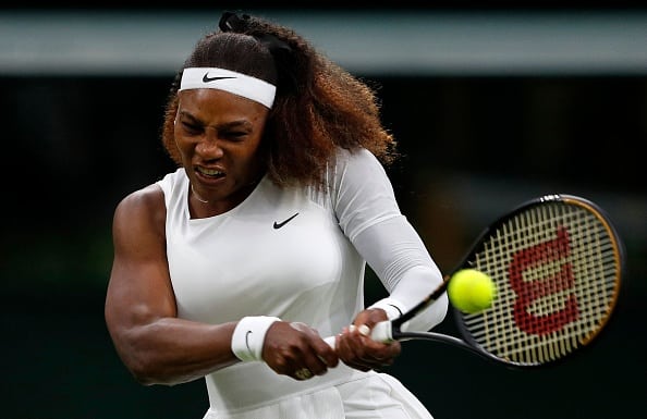 US player Serena Williams returns against Belarus's Aliaksandra Sasnovich during their women's singles first round match on the second day of the 2021 Wimbledon Championships at The All England Tennis Club in Wimbledon