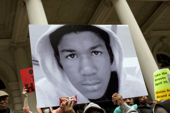 People along with New York City Council members attend a press conference to call for justice in the February 26 killing of 17-year-old Trayvon Martin in Sanford