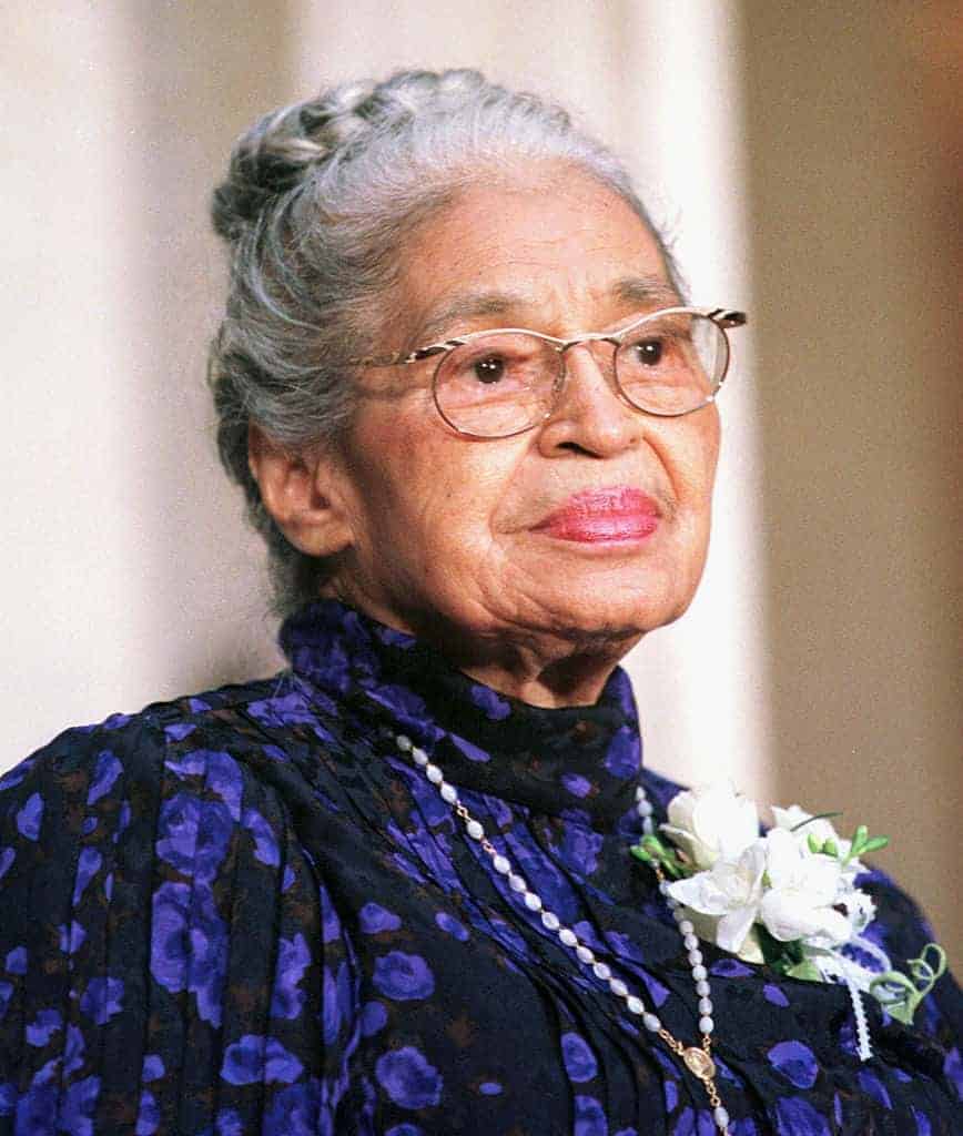 Rosa Parks wearing purple and black dress