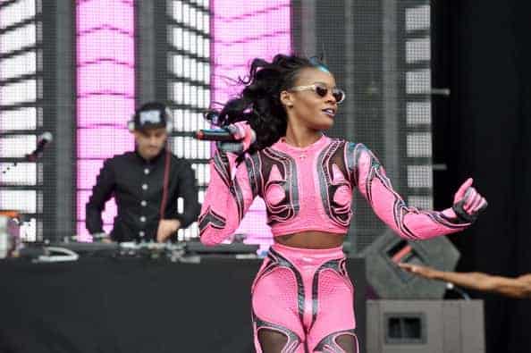 Azealia Banks performing.in pink and black outfit