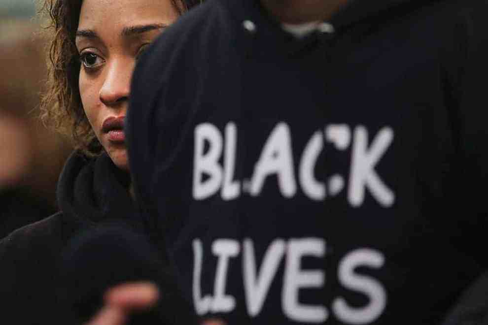 Woman holding "Black LIves Matter" sign