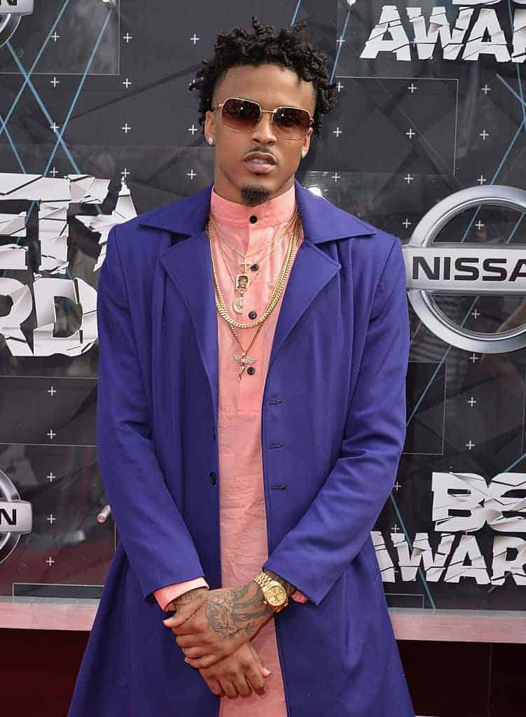 August Alsina wearing purple and orange attends the BET Awards