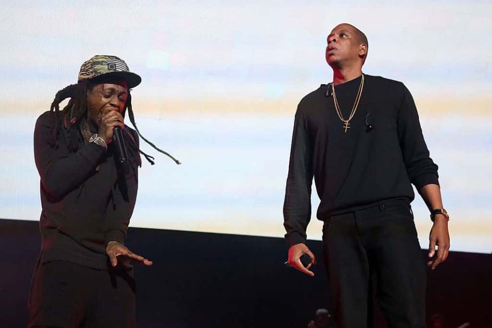 Jay-z and Lil Wayne wearing black on stage