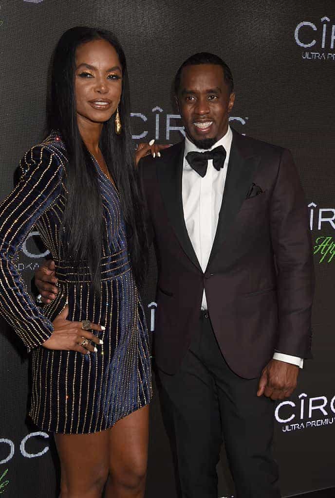 Kim Porter and Diddy wearing all black