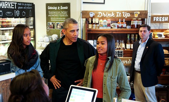 President Barack Obama buys ice cream for his daughters Malia and Sasha at Pleasant Pops during Small Business Saturday on November 28