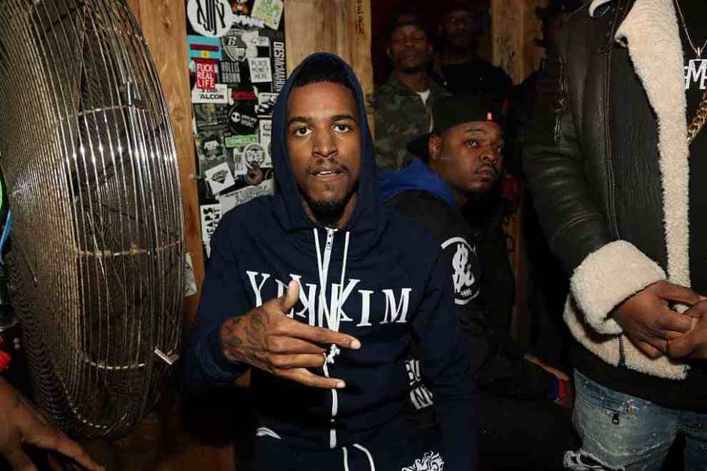Lil Reese wearing a blue hoodie