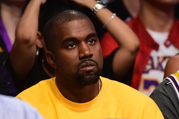 Kanye West looks on as he watches as the Los Angeles Lakers take on the Utah Jazz at Staples Center on April 13