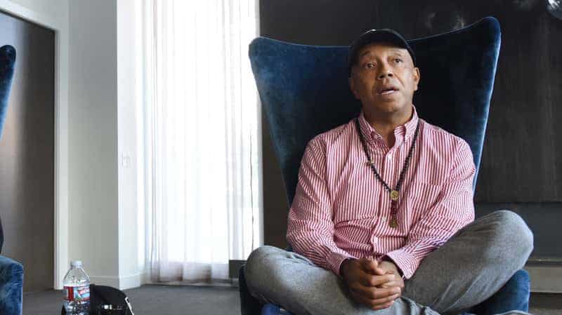 Entrepreneur Russell Simmons enters the "AOL Build" taping at the AOL Studios on July 17