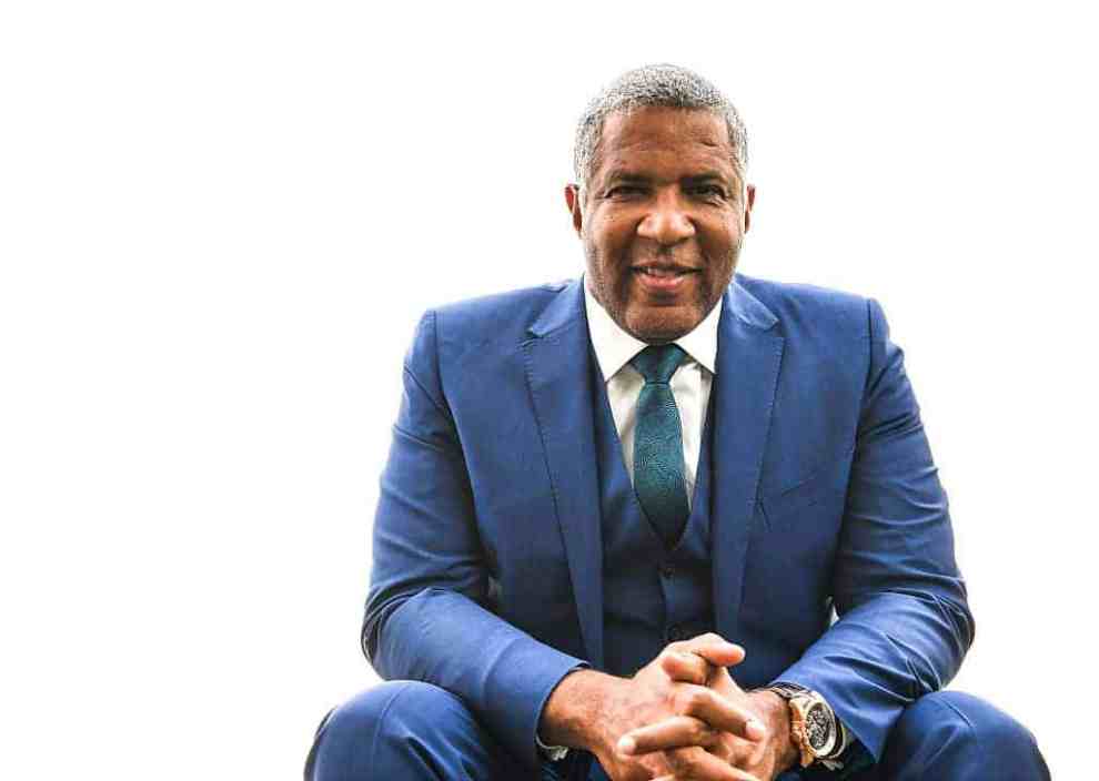 Robert F. Smith wearing a blue suit