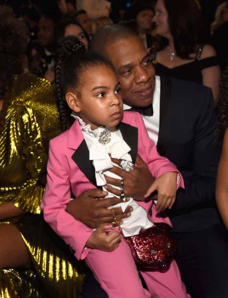 Jay-z and blue ivy Carter with suits