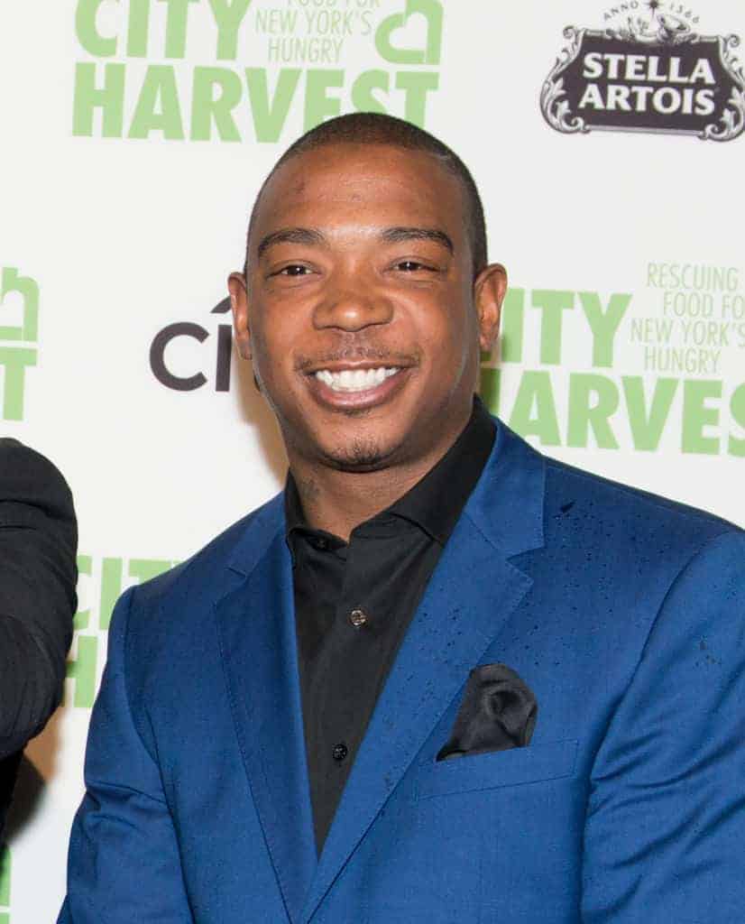 Ja Rule wearing a blue blazer smiling