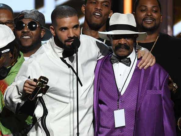Recording artist Drake (L) accepts the Top Artist award with his father Dennis Graham during the 2017 Billboard Music Awards at T-Mobile Arena on May 21