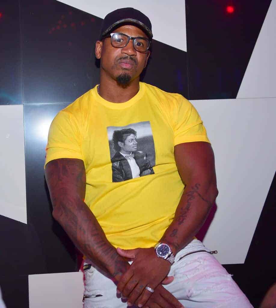 Stevie J wearing a yellow shirt