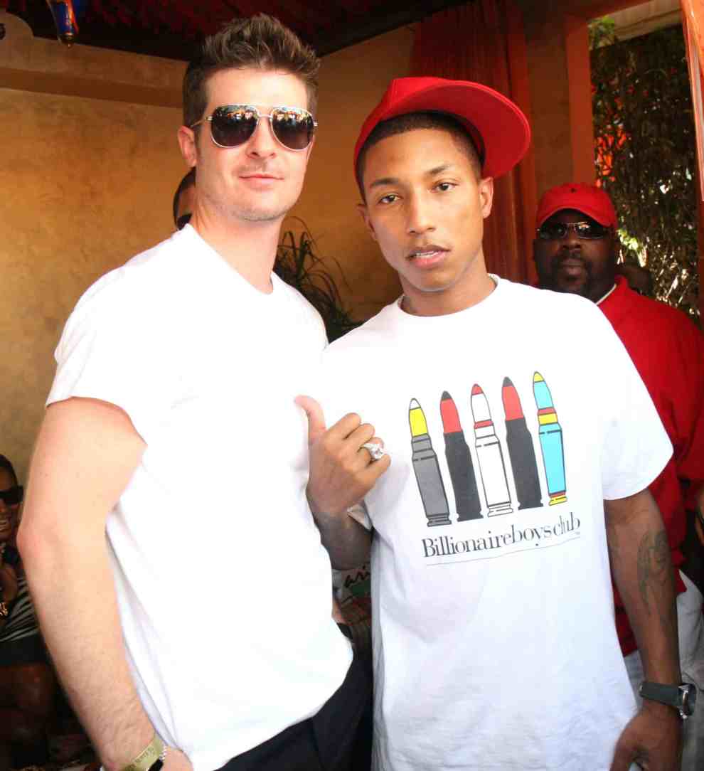 Robin Thicke and Pharrell Williams looking at the camera