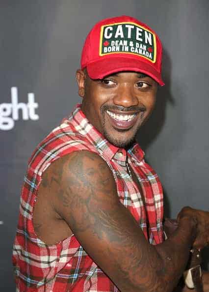 Ra j smiling on the red carpet