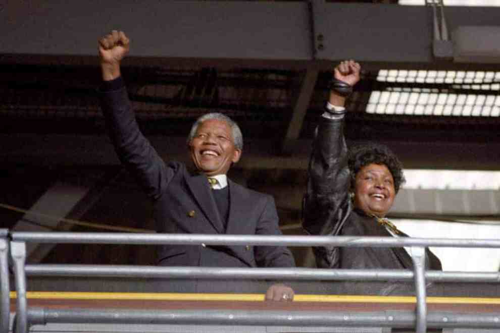 A jubilent Nelson Mandela and his wife Winnie cheering at the concert for him at Wembley Stadium