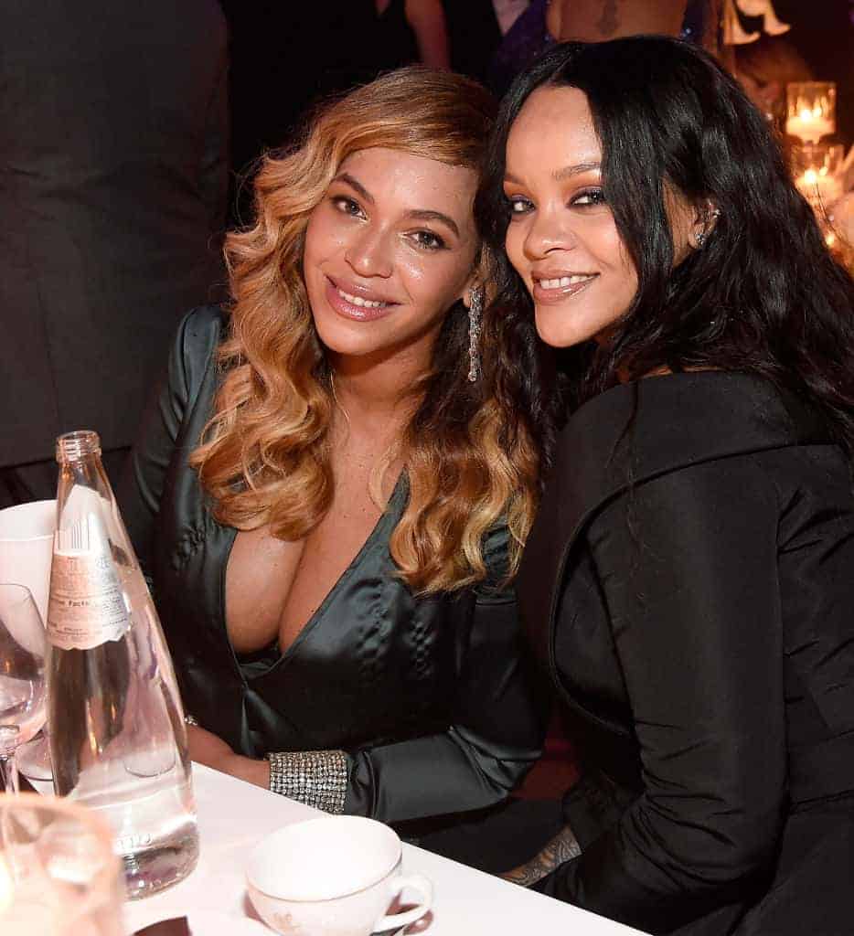 Beyonce and Rihanna smiling at the camera