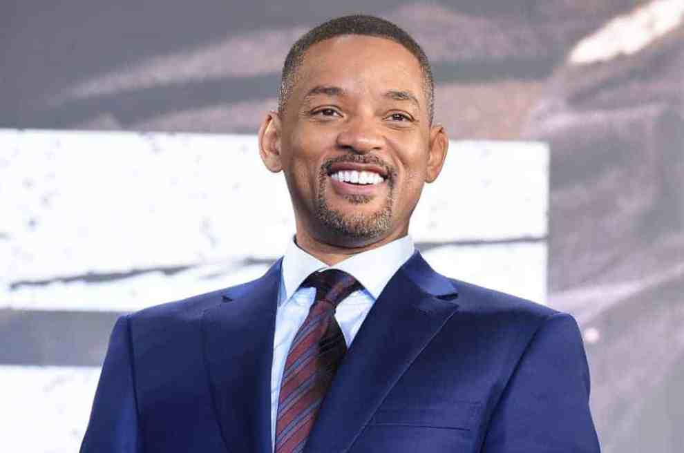 Will Smith Smiling with a blue suit on