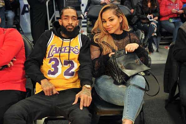 Rapper Nipsey Hussle and Lauren London attend a basketball game between the Los Angeles Lakers and the Minnesota Timberwolves at
