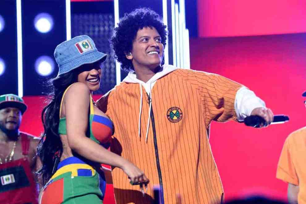 Cardi B and Bruno Mars wearing bright colors