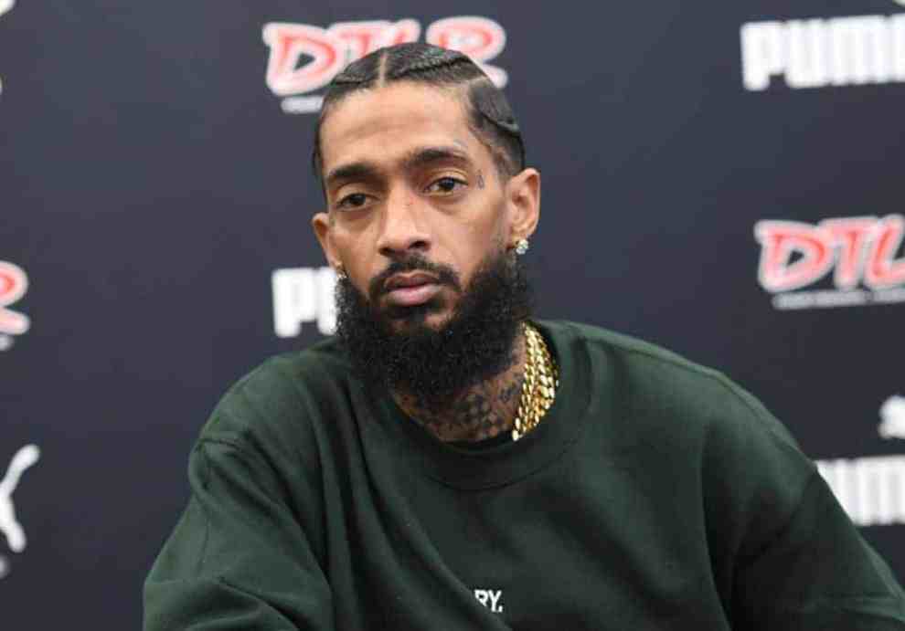 Nipsey Hussle wearing a green sweater
