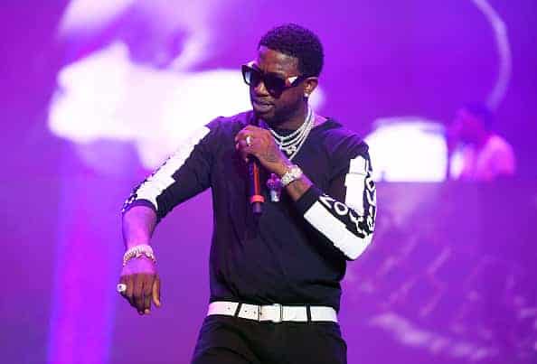 Gucci Mane performing on stage.