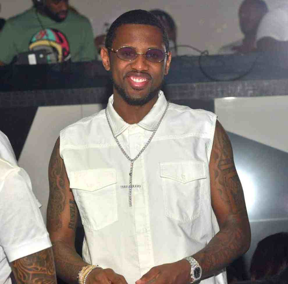Fabolous wearing all white and smiling