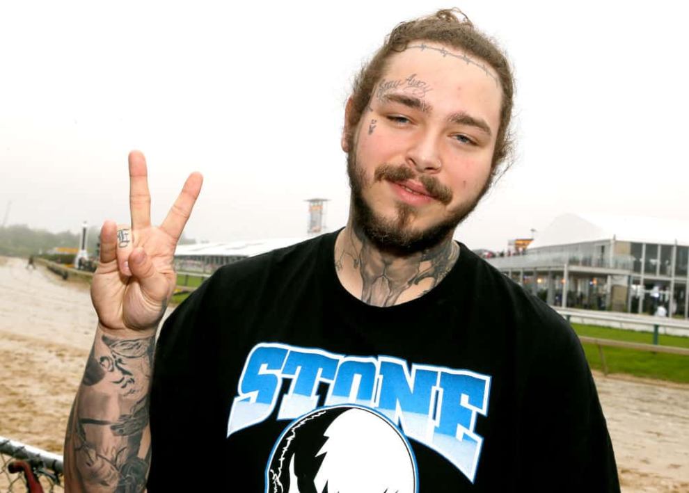 Post Malone giving peace sign