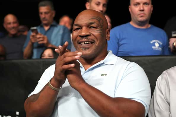 Former World Champion boxer Mike Tyson claps as the 2018 Hall of Fame class is introduced during the Golden Boy on ESPN fight ni