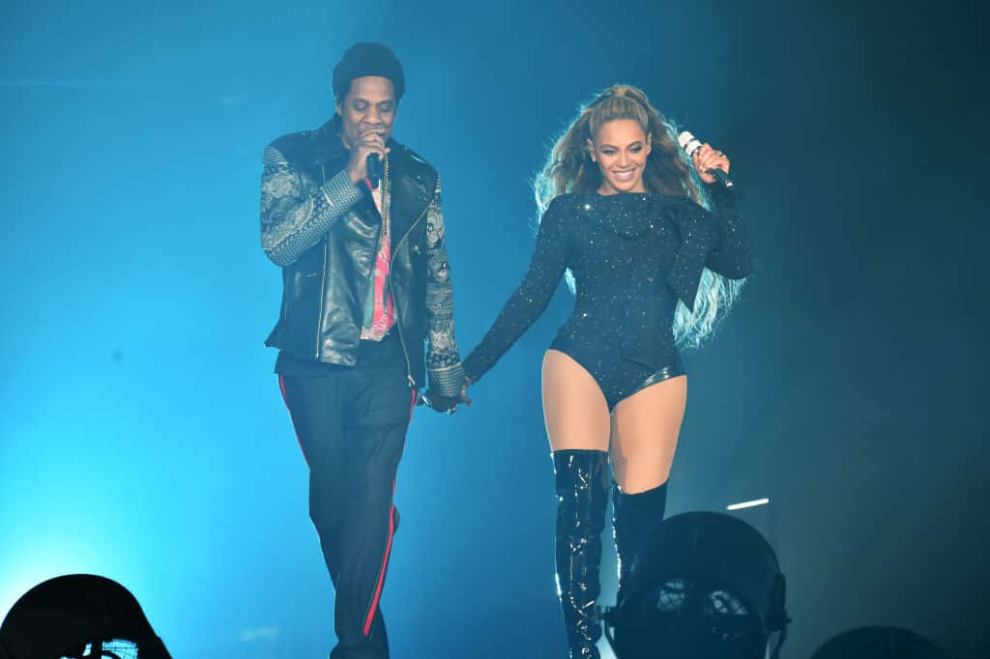 Beyonce and Jay-Z perform together holding hands on stage during the 'On the Run II' Tour at Hampden Park on June 9
