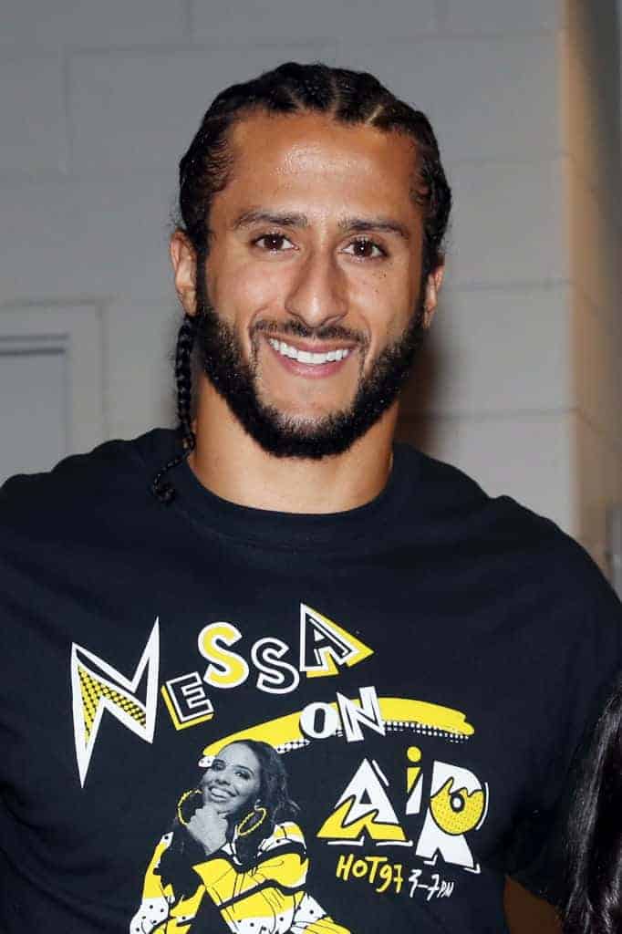 Kaepernick wearing a black Nessa on Air Hot 97 t-shirt with hair in braids
