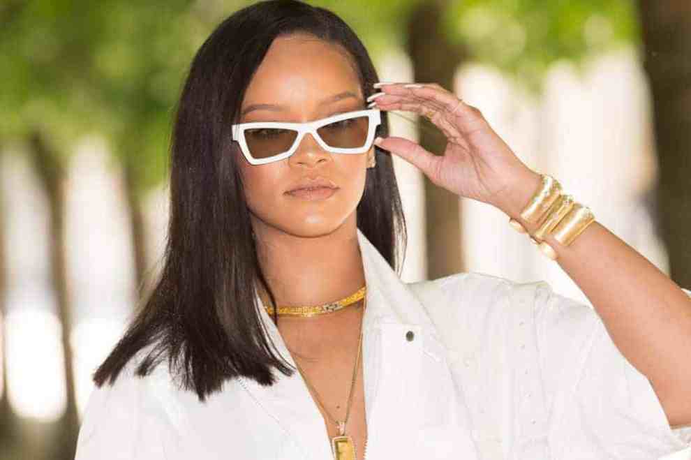 Rihanna in white sunglasses and white shirt