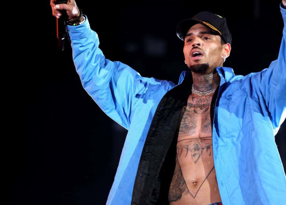 Chris Brown on stage wearing Blue Jacket