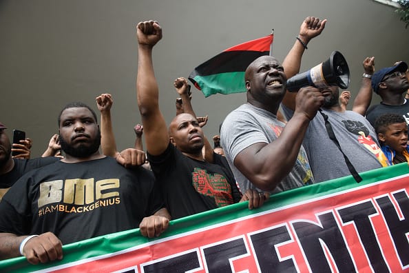 Demonstrators speak during a Juneteenth celebration that protested the police shooting of Antwon Rose on June 23