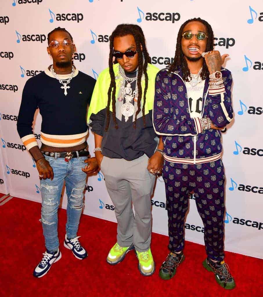 Migos wearing multiple colors on the read carpet