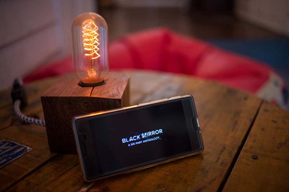 Black Mirror logo with a lightbulb