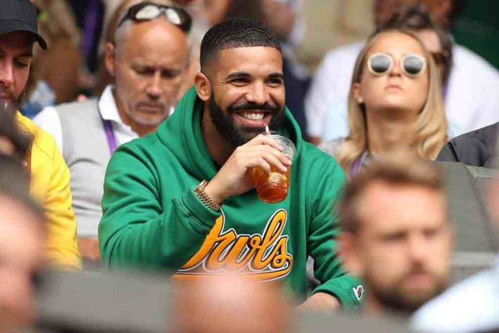 Rapper Drake sits on Centre Court before US player Serena Williams plays against Italy's Camila Giorgi during their women's singles quarter-final match on the eighth day of the 2018 Wimbledon Championships at The All England Lawn Tennis Club in Wimbledon