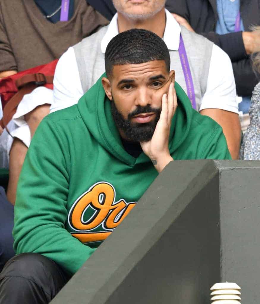 Drake attending game in green owl sweatshirt