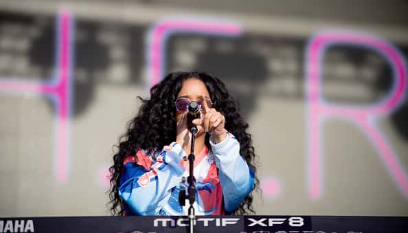 H.E.R live on stage.
