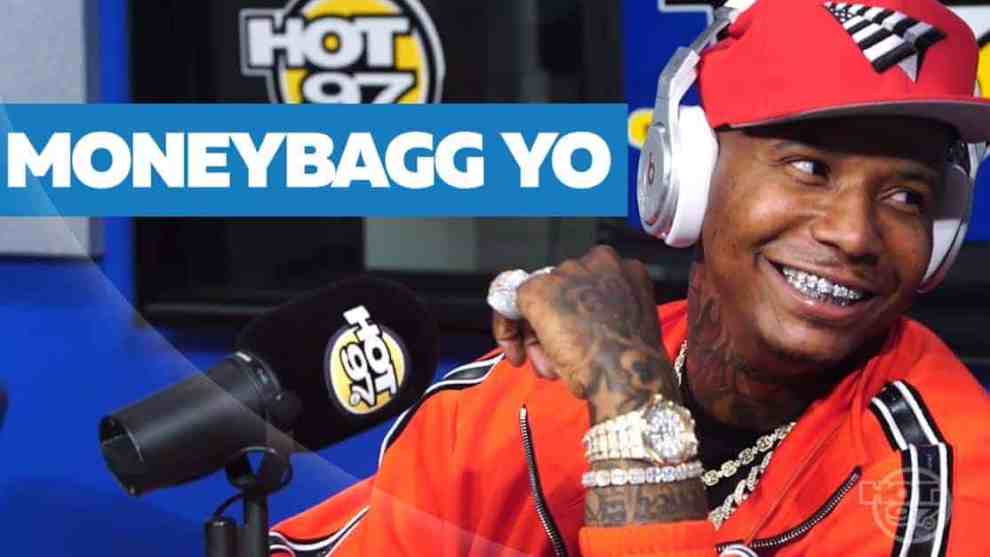 American rapper Moneybagg Yo in a red hat and jacket