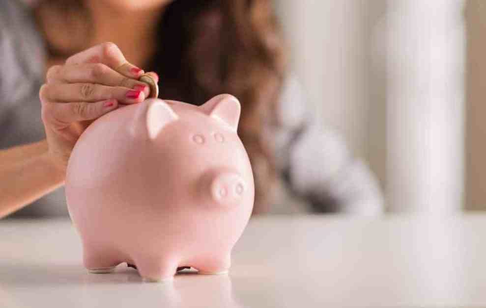Woman putting coins into a piggy bank.