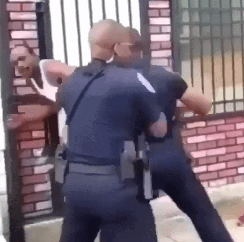 Baltimore police assaulting man